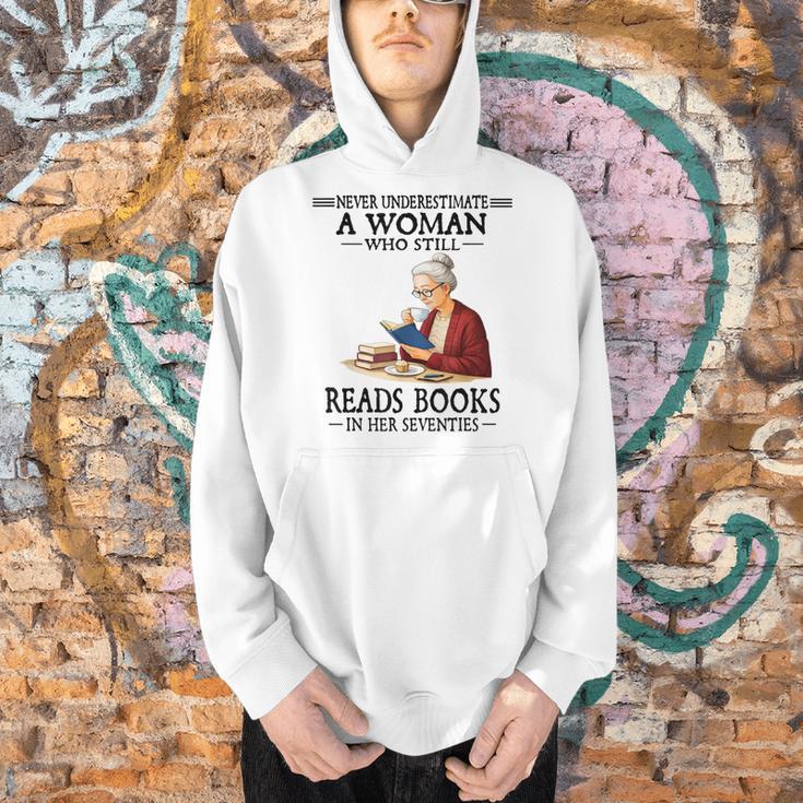 Never Underestimate A Woman Who Still Reads Books In Her Men Hoodie