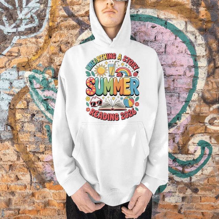 Unearth a Story Summer 2026 Summer Reading Program Book Premium Tri-Blend Men Hoodie