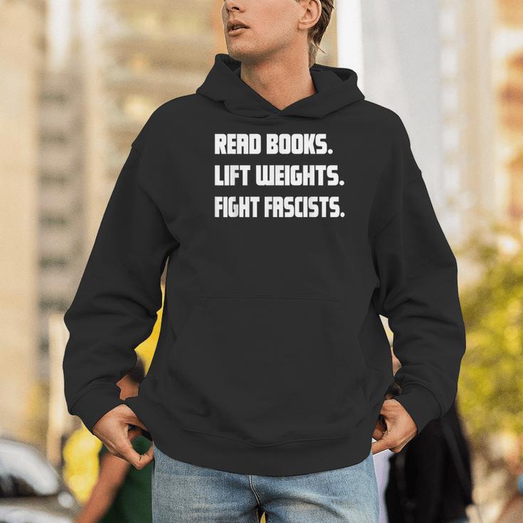 Read Books Lift Weights Fight Fascists Reading Activism Meme Men Hoodie Read Books Lift Weights Fight Fascists Reading Activism Meme Men Hoodie