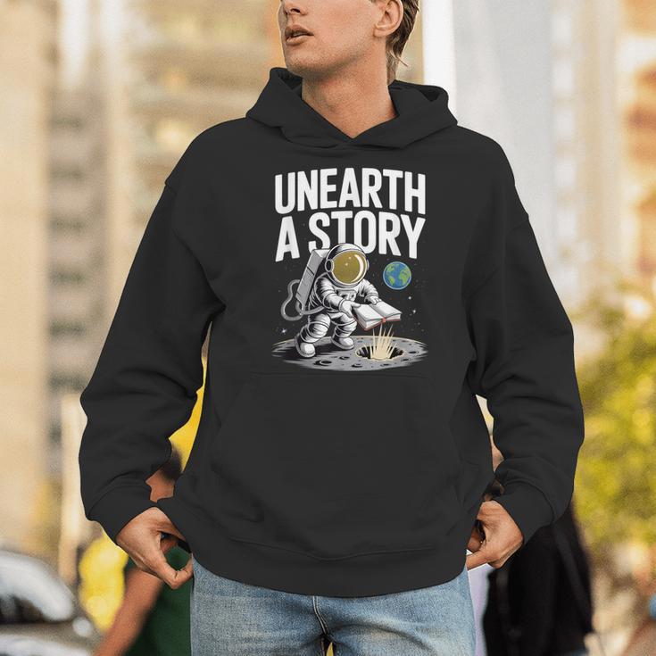 Unearth A Story Astronaut Finds Book On The Moon Men Hoodie