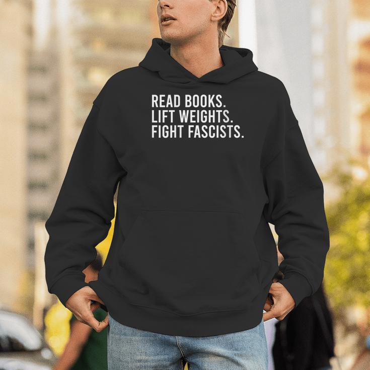 Women's Read Books Lift Weights Fight Fascists Reading Activism Men Hoodie Women's Read Books Lift Weights Fight Fascists Reading Activism Men Hoodie