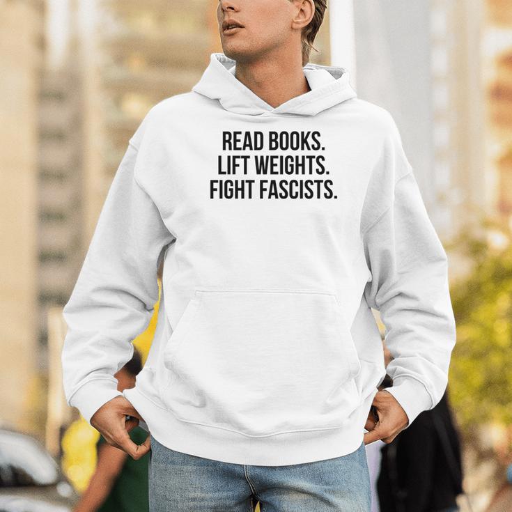Read Books Lift Weights Fight Fascists Premium Tri-Blend Men Hoodie
