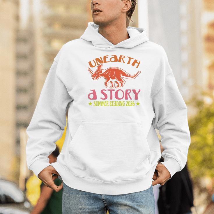 Unearth a Story Summer Reading 2026 Triceratops Dino Book Men Hoodie