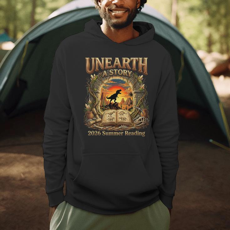 2026 Summer Reading Dinosaur Unearth A Story Book Lover Men Hoodie 2026 Summer Reading Dinosaur Unearth A Story Book Lover Men Hoodie