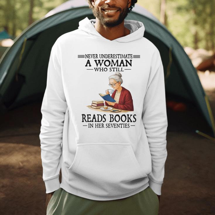 Never Underestimate A Woman Who Still Reads Books In Her Men Hoodie