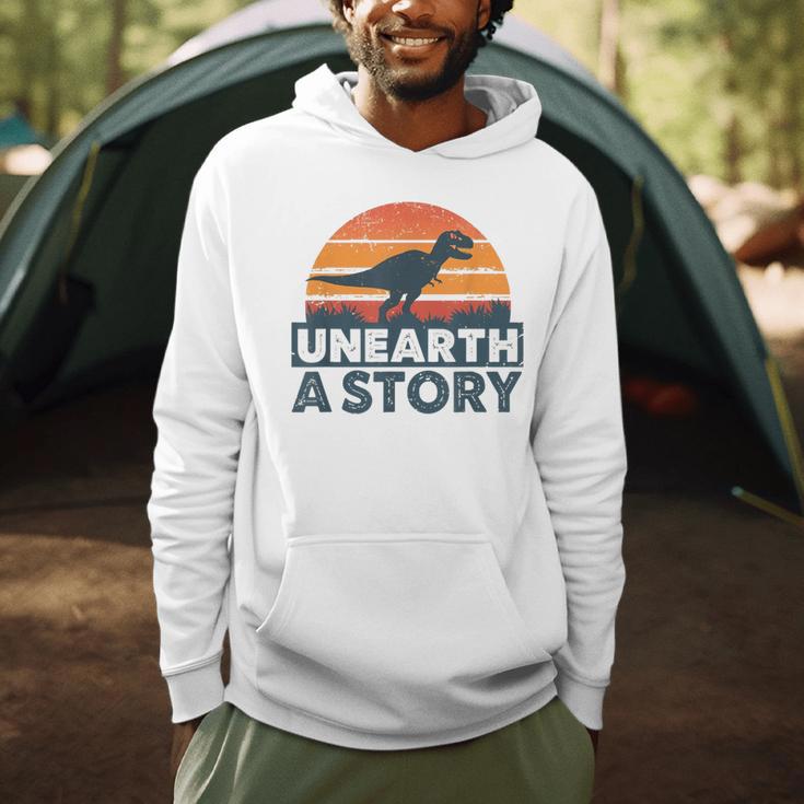 Unearth A Story Dinosaur Reader Book Lover 2026 Men Hoodie