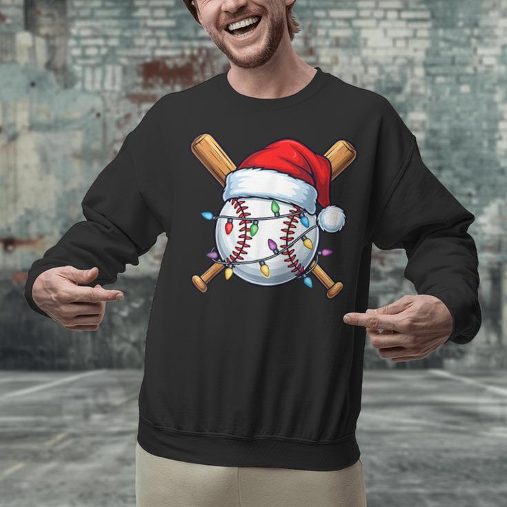 Baseball Christmas Lights Santa Christmas Baseball Player Unisex Sweatshirt Baseball Christmas Lights Santa Christmas Baseball Player Unisex Sweatshirt