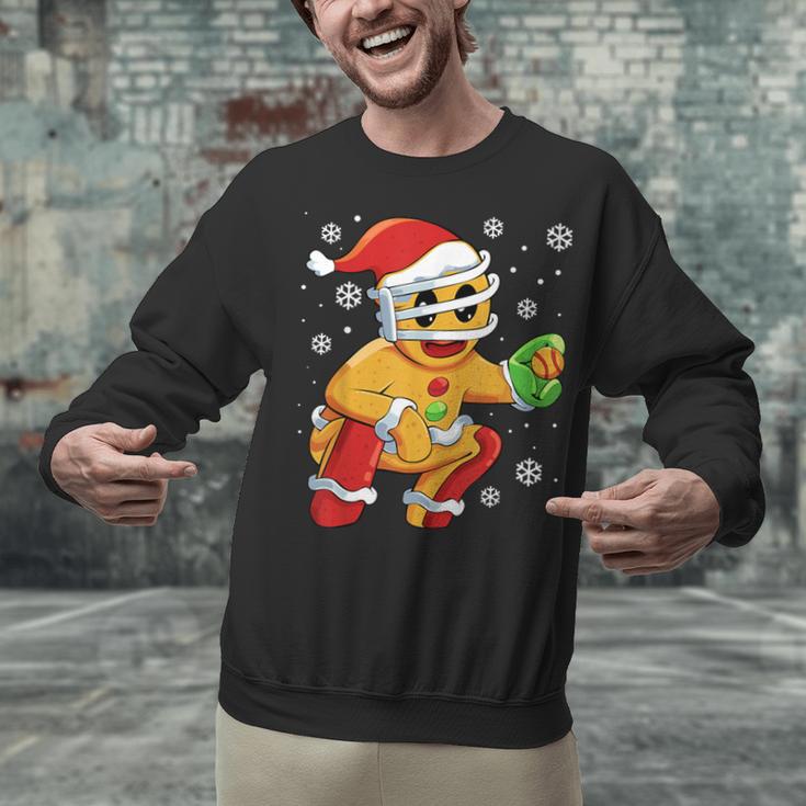 Christmas Gingerbread Man Baseball Player Catcher Unisex Sweatshirt Christmas Gingerbread Man Baseball Player Catcher Unisex Sweatshirt
