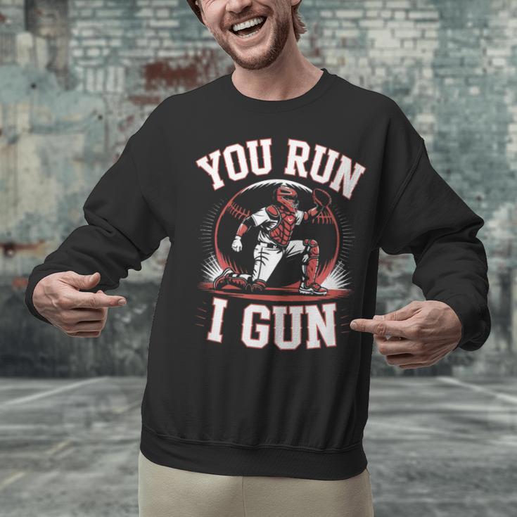 You Run I Gun Baseball Catcher Softball Player Unisex Sweatshirt You Run I Gun Baseball Catcher Softball Player Unisex Sweatshirt