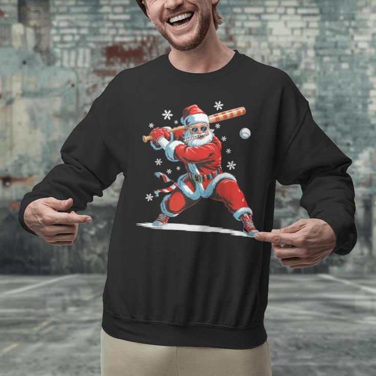 Santa Playing Baseball Christmas Candy Cane Fun Xmas Holiday Unisex Sweatshirt Santa Playing Baseball Christmas Candy Cane Fun Xmas Holiday Unisex Sweatshirt