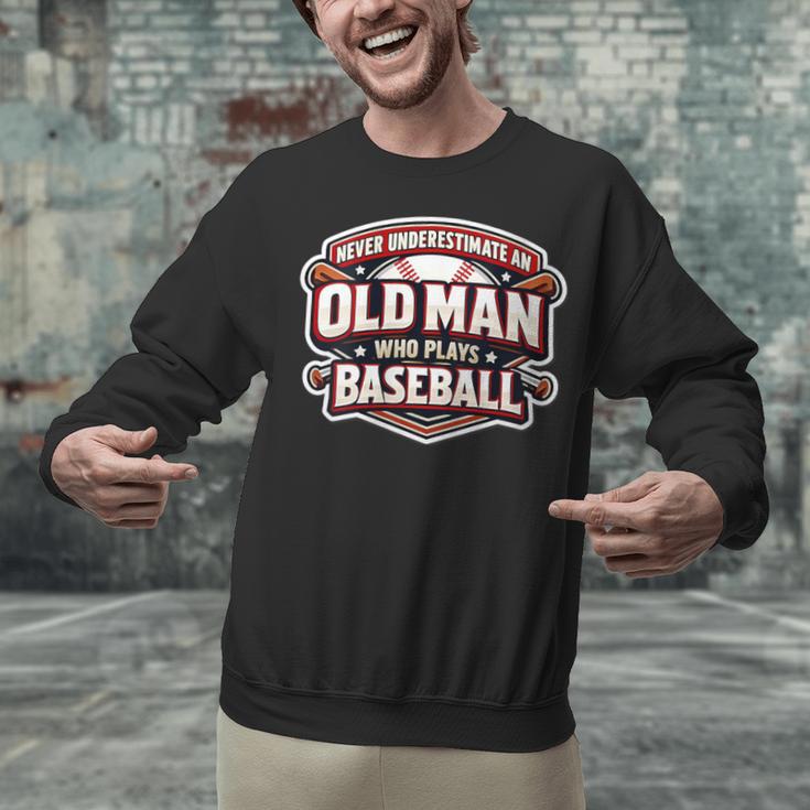 Women's Never Underestimate An Old Man Who Plays Baseball Unisex Sweatshirt Women's Never Underestimate An Old Man Who Plays Baseball Unisex Sweatshirt