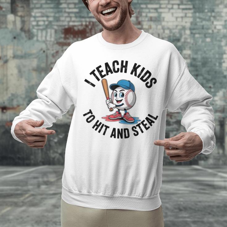 I Teach Kids To Hit And Steal Baseball Softball Coach Unisex Sweatshirt I Teach Kids To Hit And Steal Baseball Softball Coach Unisex Sweatshirt