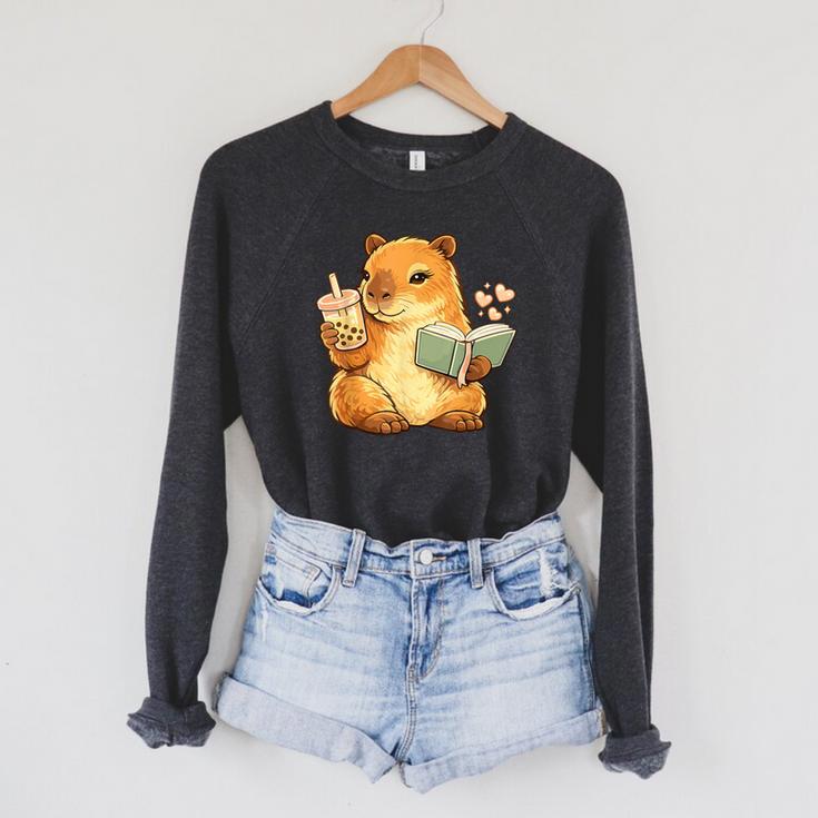Capybara Reading a Book With Bubble Tea Raglan Sleeve Sweatshirt