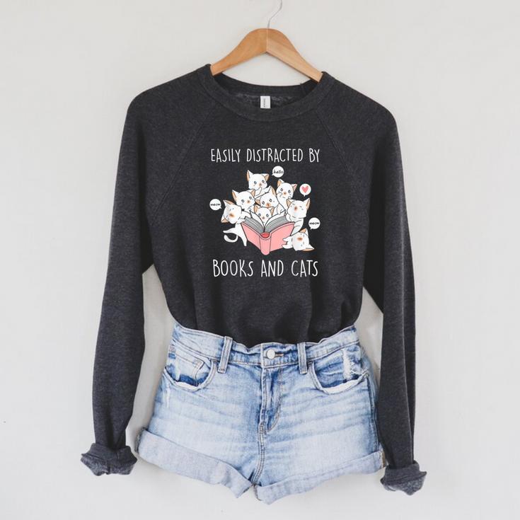 Cat & Book Lover Easily Distracted By Cats And Books For Men Women Kids Raglan Sleeve Sweatshirt