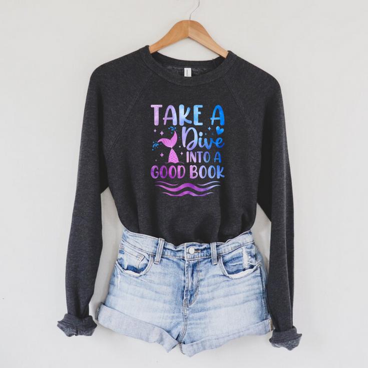 Cute Mermaid Librarian Teacher Dive Into A Good Book Reading Raglan Sleeve Sweatshirt