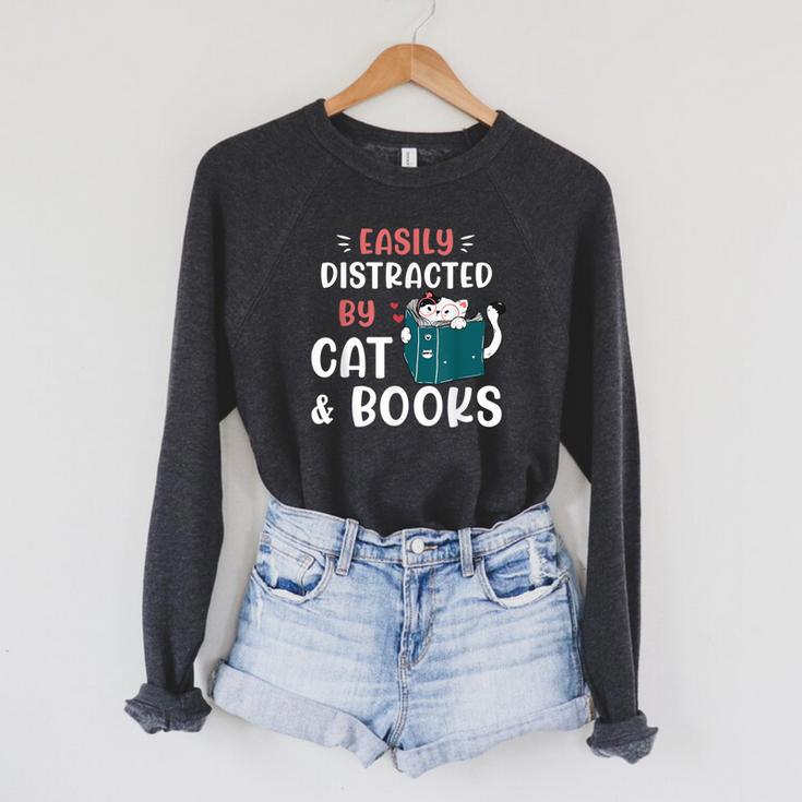 Easily Distracted By Cats And Books Cat & Book Lover For Men Women Kids Raglan Sleeve Sweatshirt