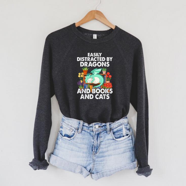 Easily Distracted By Dragons Books Cats Fantasy Book Lover Raglan Sleeve Sweatshirt