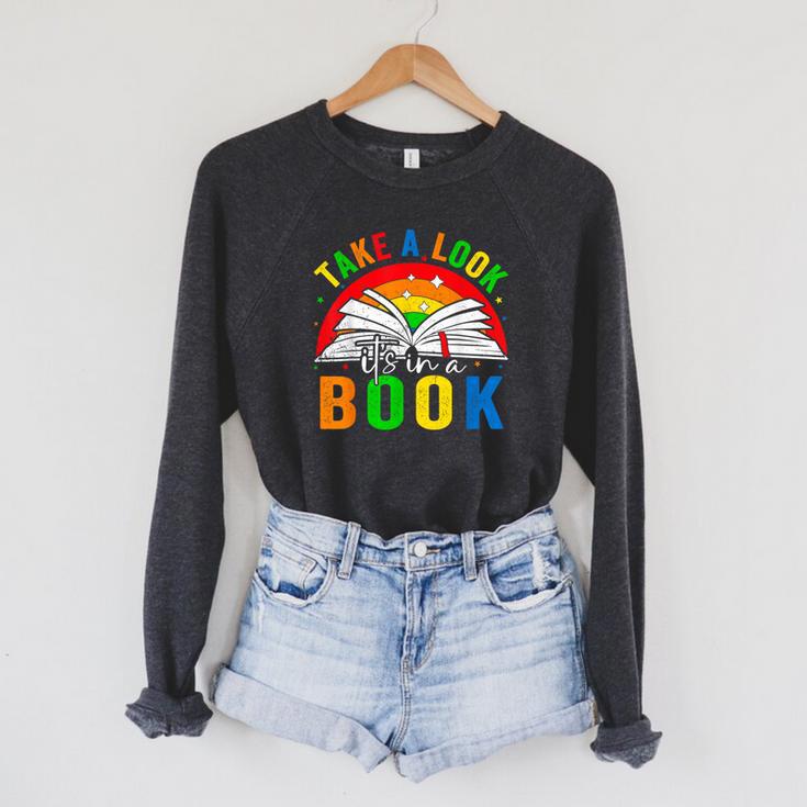 Take A Look It's In A Book Retro Groovy Reading Books Lovers Raglan Sleeve Sweatshirt