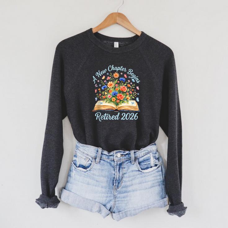 New Chapter Begins Retired 2026 Watercolor Floral Book Women Raglan Sleeve Sweatshirt