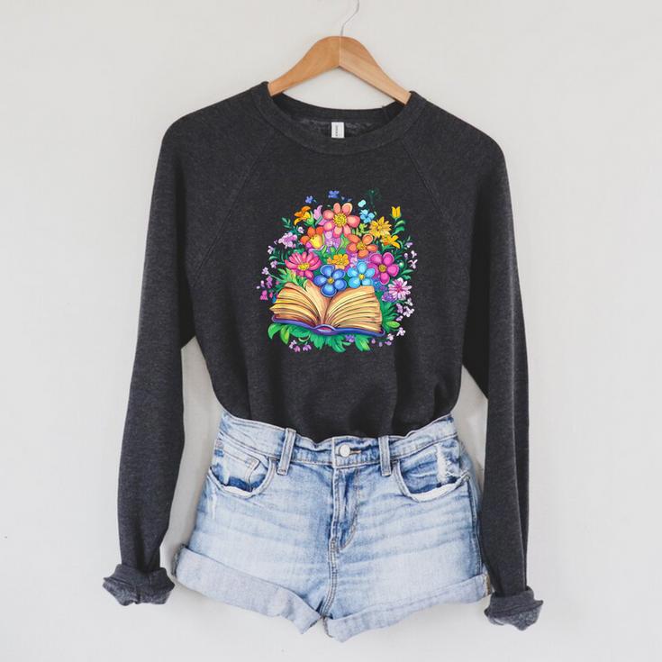 Open Book Surrounded By Colorful Spring Flowers Bloom Raglan Sleeve Sweatshirt