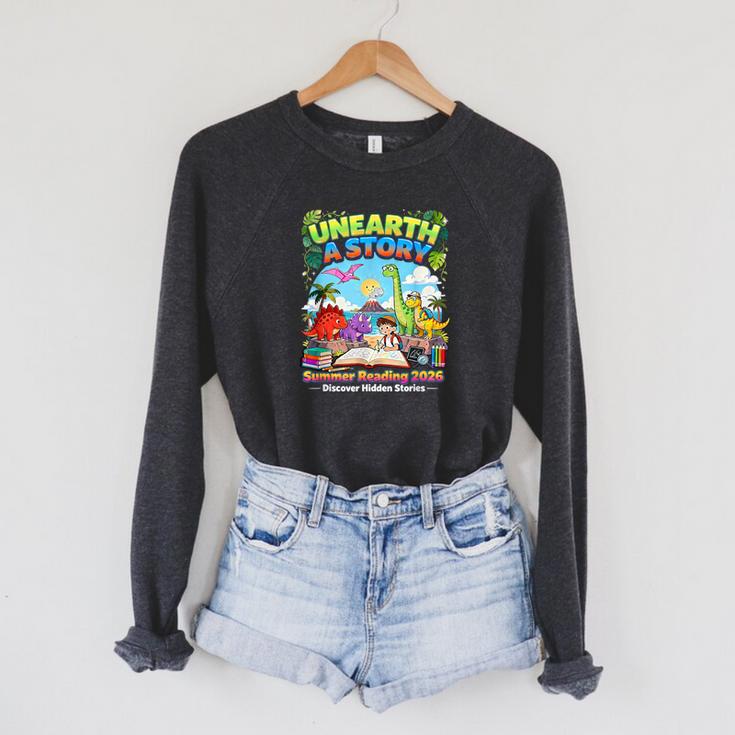 Unearth A Story Dinosaur Books Summer Reading 2026 Raglan Sleeve Sweatshirt