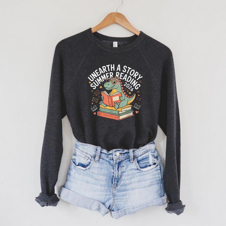 Unearth A Story Summer Reading 2026 Dinosaur Books Raglan Sleeve Sweatshirt