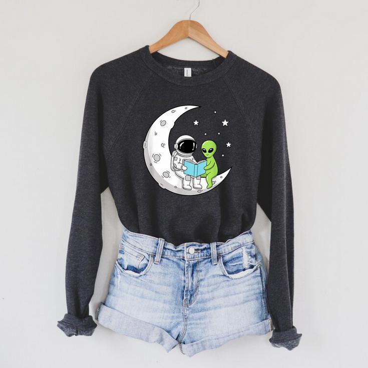 Astronaut And Alien Reading On Moon Space Book Lover Sci Fi Raglan Sleeve Sweatshirt