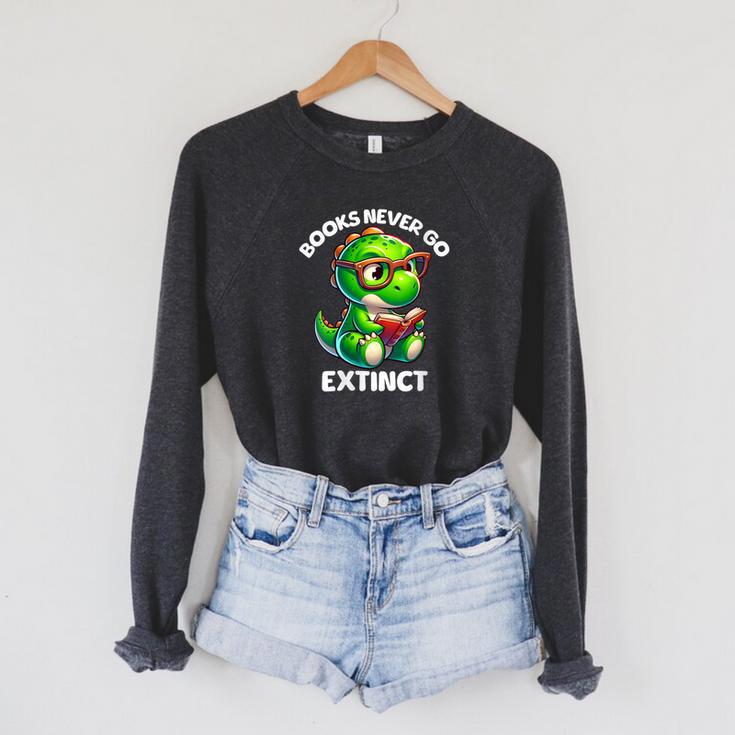 Books Never Go Extinct Reading Dinosaur Bookish Nerdy Raglan Sleeve Sweatshirt