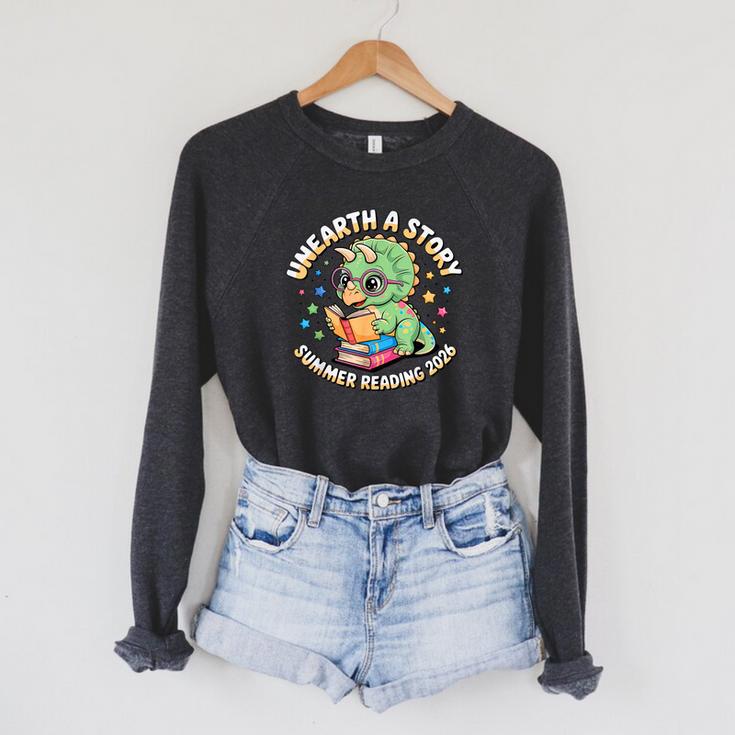Dino Reading Books Unearth a Story Summer Reading Dinosaur Raglan Sleeve Sweatshirt