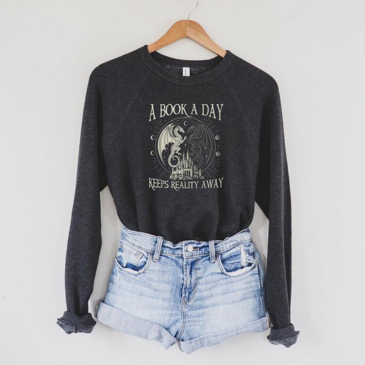 Fantasy Book Club Dragon Reader Book A Day Keep Reality Away Raglan Sleeve Sweatshirt
