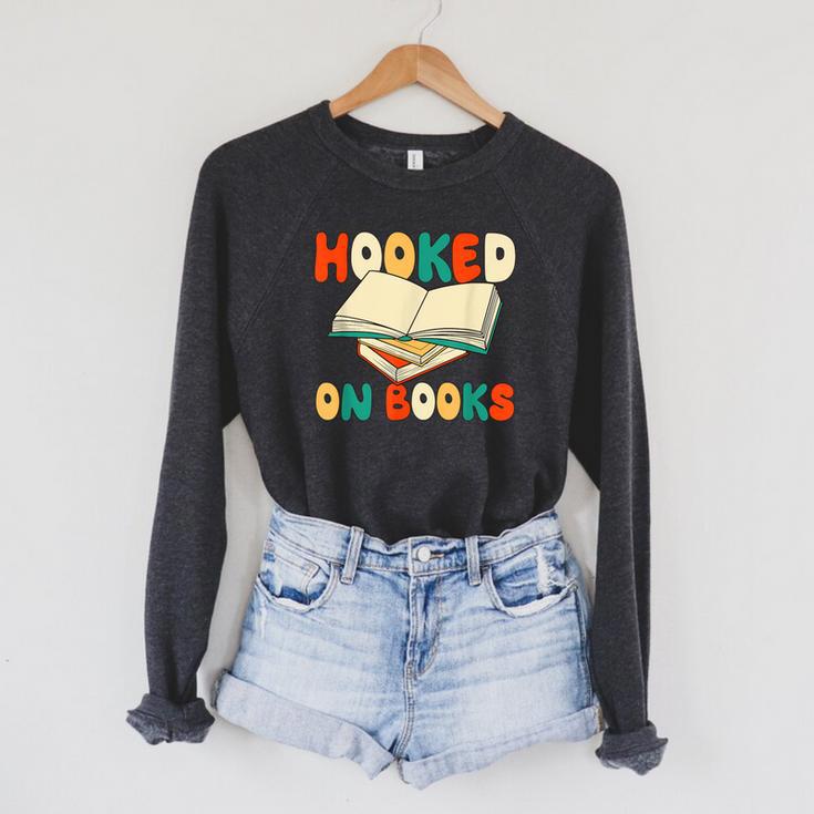 Hooked On Books Retro Reader Raglan Sleeve Sweatshirt