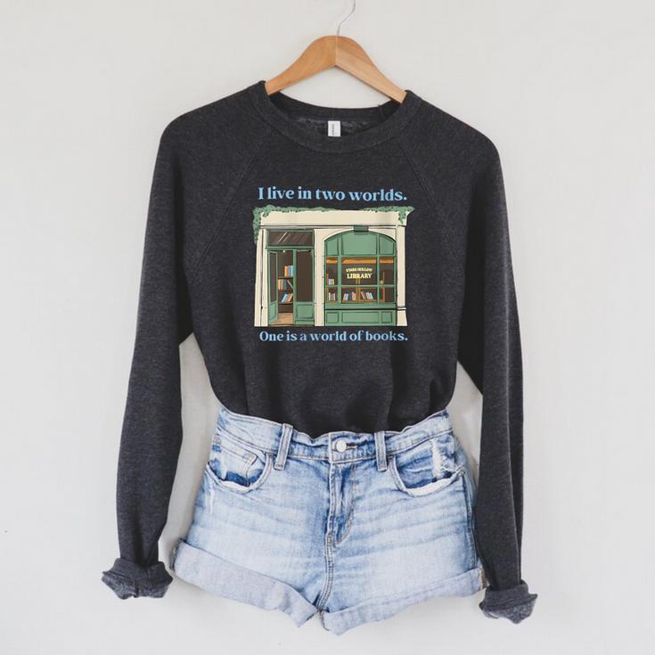 I Live In Two Worlds One Is A World Of Books Raglan Sleeve Sweatshirt