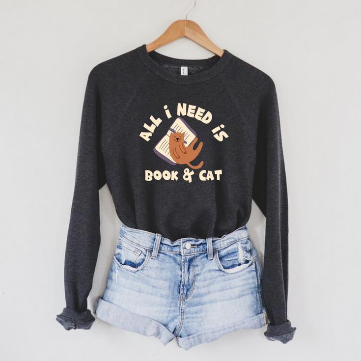 All I Need Is Book & Cat Book Lovers Cat Owners Humour Raglan Sleeve Sweatshirt