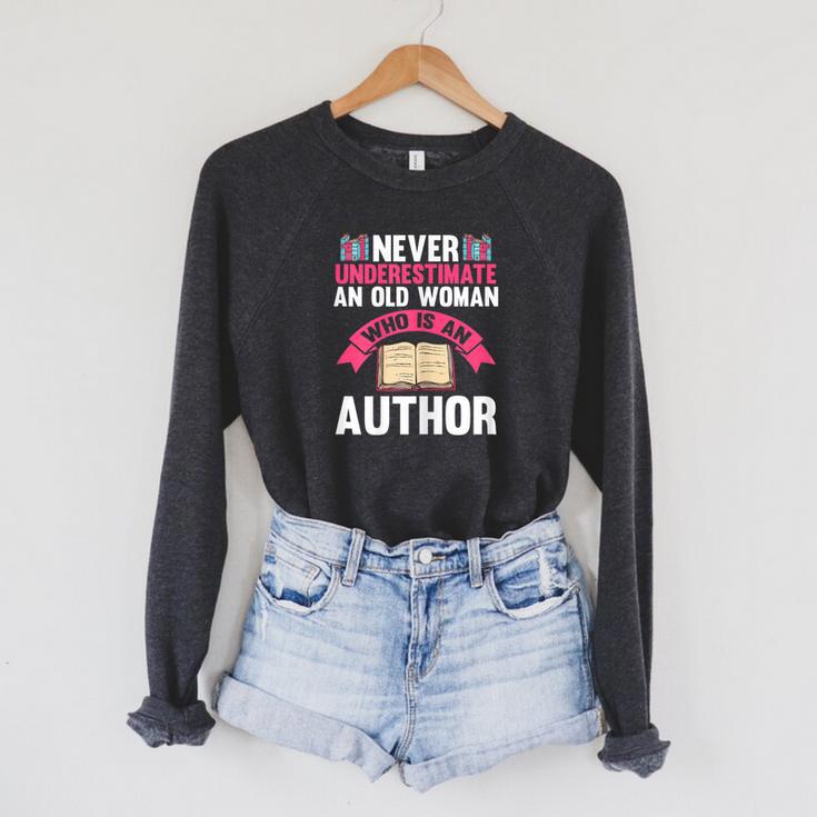 Never Underestimate An Old Woman Author Write Book Raglan Sleeve Sweatshirt