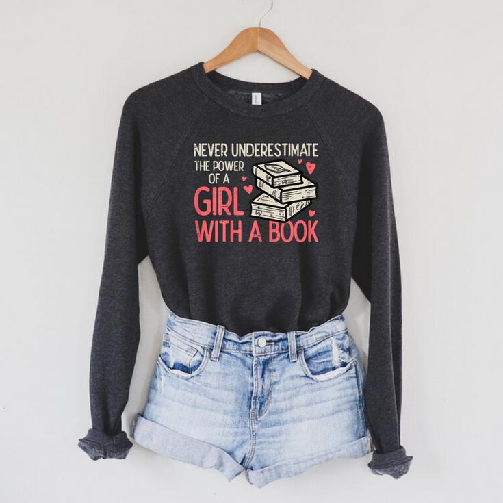 Never Underestimate Power Of Girl With Book Bookworm Women Raglan Sleeve Sweatshirt Never Underestimate Power Of Girl With Book Bookworm Women Raglan Sleeve Sweatshirt