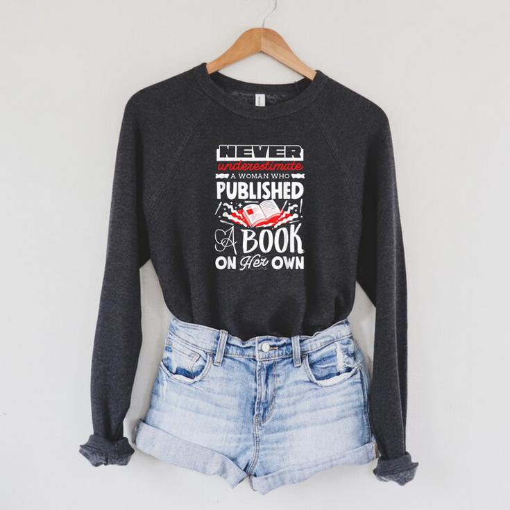 Never Underestimate Published Author Novelist Book Author Raglan Sleeve Sweatshirt