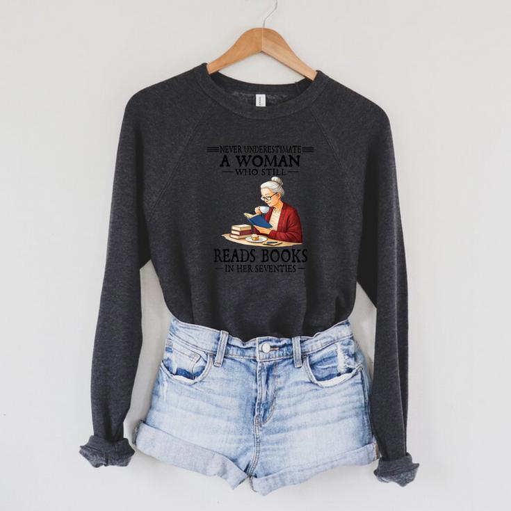 Never Underestimate A Woman Who Still Reads Books In Her Raglan Sleeve Sweatshirt