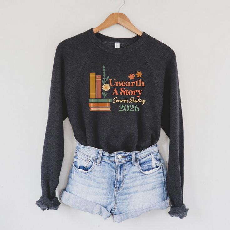 Unearth a Story Summer Reading 2026 Library Teachers Book Raglan Sleeve Sweatshirt Unearth a Story Summer Reading 2026 Library Teachers Book Raglan Sleeve Sweatshirt