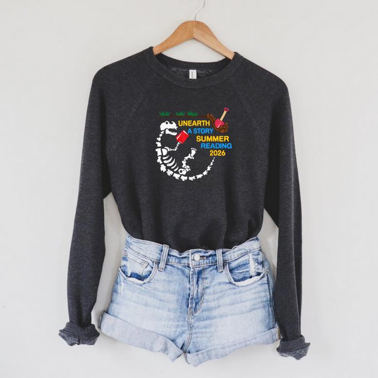 Unearth a Story T-Rex Reading a Book Summer Reading 2026 Raglan Sleeve Sweatshirt Unearth a Story T-Rex Reading a Book Summer Reading 2026 Raglan Sleeve Sweatshirt