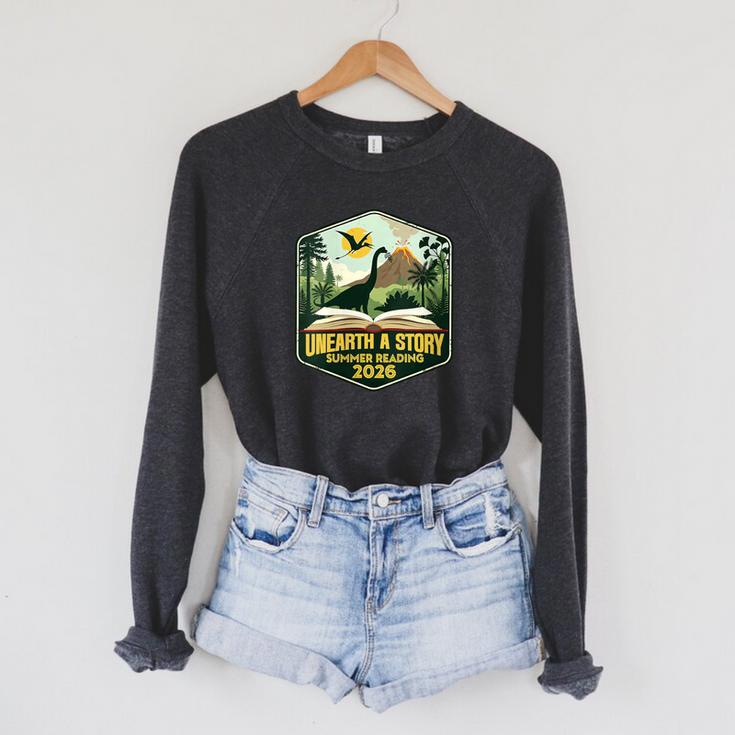 Women's 2026 Summer Reading Unearth a Story Teachers Students Book Raglan Sleeve Sweatshirt Women's 2026 Summer Reading Unearth a Story Teachers Students Book Raglan Sleeve Sweatshirt