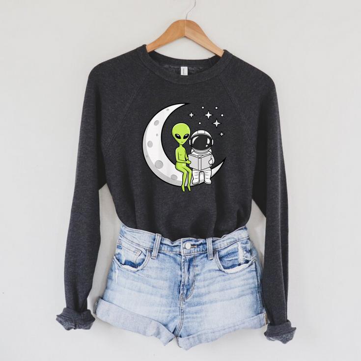 Women's Alien And Astronaut Reading On Moon Kids Sci Fi Book Raglan Sleeve Sweatshirt