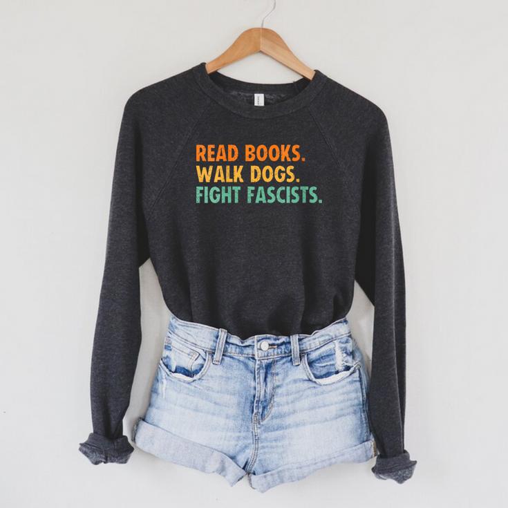 Women's Read Books Walk Dogs Fight Fascists Raglan Sleeve Sweatshirt Women's Read Books Walk Dogs Fight Fascists Raglan Sleeve Sweatshirt