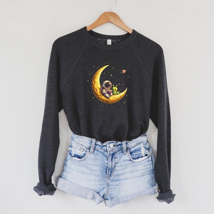 Astronaut Reading Book To Alien Moon Space Astronomy Raglan Sleeve Sweatshirt