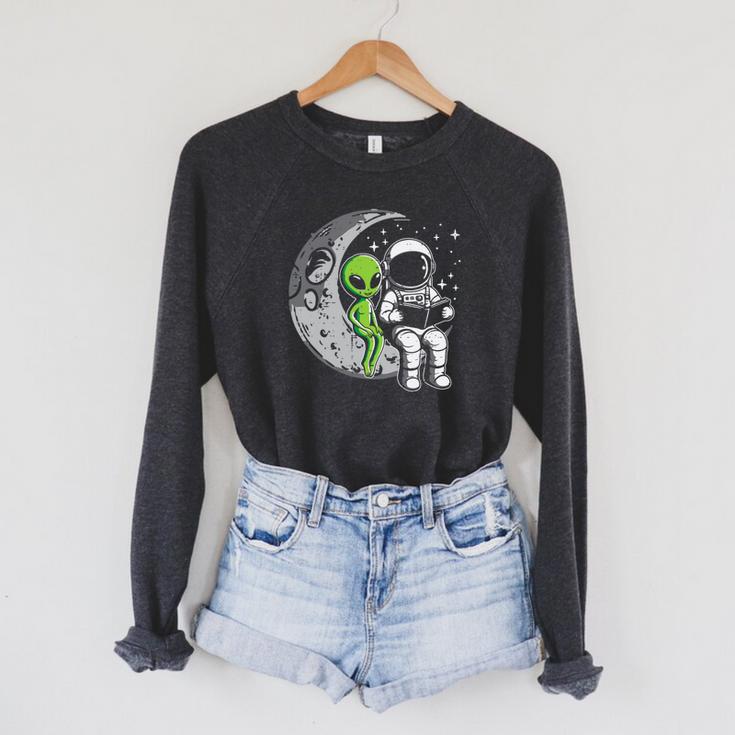 Astronaut Reading Book To Alien Moon Space Women Kids Men Premium Tri-Blend Raglan Sleeve Sweatshirt