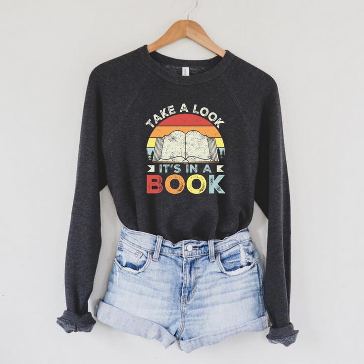 Take A Look It's In A Book Retro Reading Premium Tri-Blend Raglan Sleeve Sweatshirt