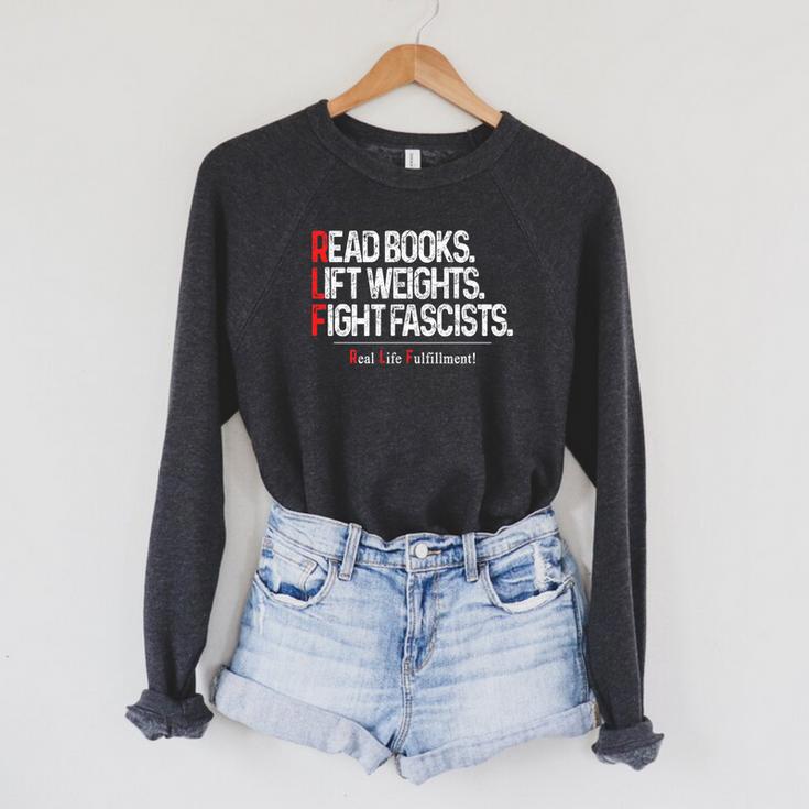 Read Books Lift Weights Fight Fascists Real Life Fulfillment Premium Tri-Blend Raglan Sleeve Sweatshirt