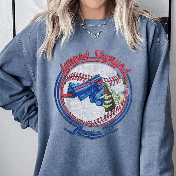 Lynyrd Skynyrd Skeleton Baseball Gun US Flag Cowboy Rock Fan Comfort Colors Sweatshirt Lynyrd Skynyrd Skeleton Baseball Gun US Flag Cowboy Rock Fan Comfort Colors Sweatshirt