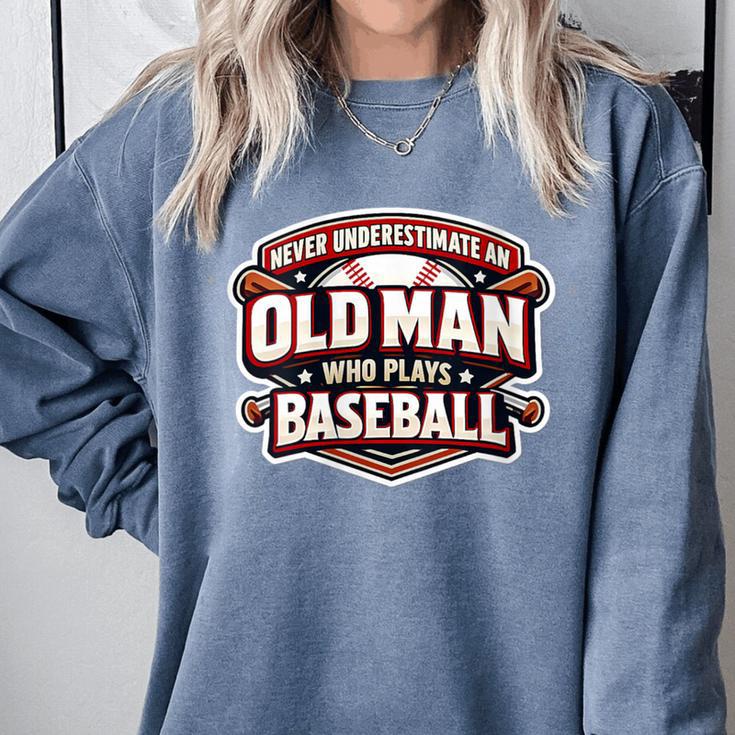 Women's Never Underestimate An Old Man Who Plays Baseball Comfort Colors Sweatshirt Women's Never Underestimate An Old Man Who Plays Baseball Comfort Colors Sweatshirt