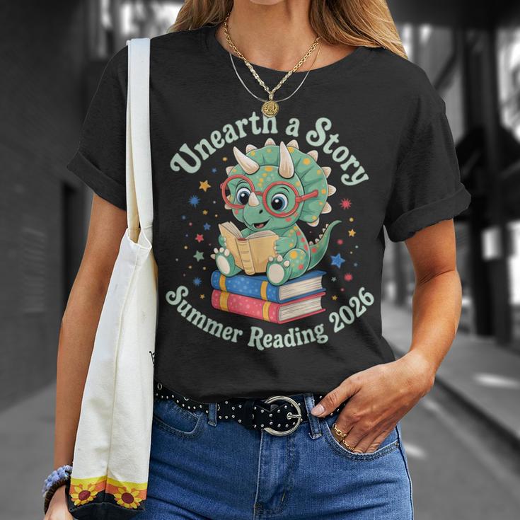 Unearth a Story Summer Reading 2026 Cute Dinosaur Book Lover T-Shirt Gifts for Her Unearth a Story Summer Reading 2026 Cute Dinosaur Book Lover T-Shirt Gifts for Her