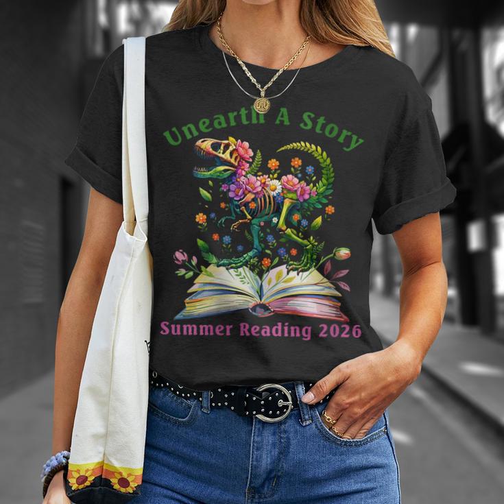 Women's Unearth A Story Summer Reading 2026 Dinosaur Book Floral T-Shirt Gifts for Her